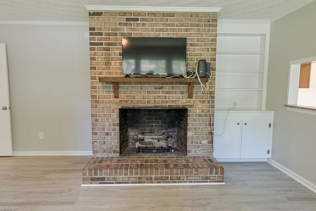100 Woodland Cir, Franklin, VA 23851 - detailed view of ornamental molding, wood finished floors, baseboards, built in shelves, and a brick fireplace