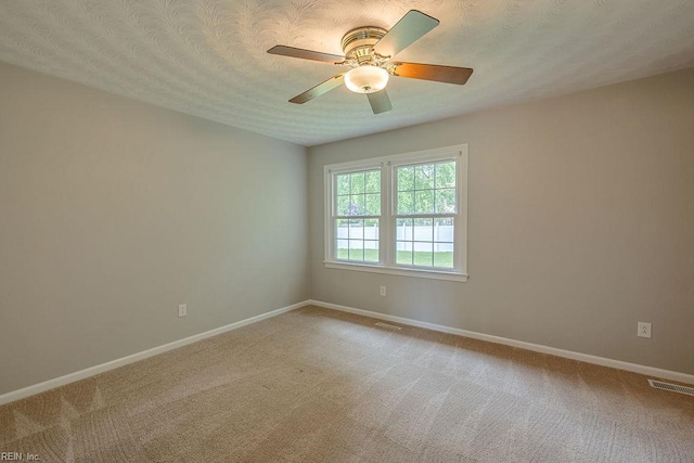 100 Woodland Cir, Franklin, VA 23851 - carpeted empty room with baseboards, ceiling fan, and a textured ceiling
