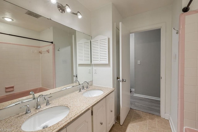 100 Woodland Cir, Franklin, VA 23851 - full bath featuring double vanity, baseboards, and tile patterned flooring