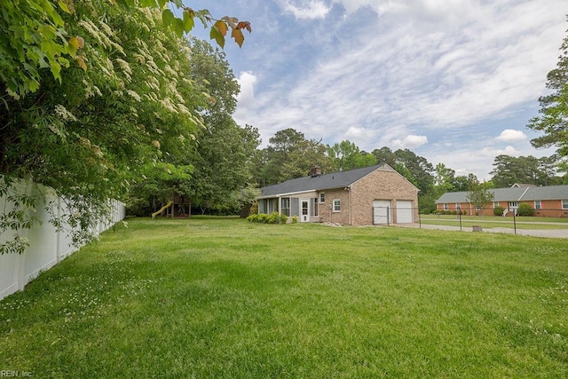 100 Woodland Cir, Franklin, VA 23851 - view of yard featuring a playground and a garage