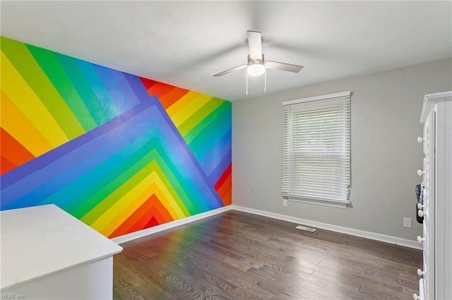 628 Briarwood Dr, Chesapeake, VA 23322 - spare room featuring an accent wall, a ceiling fan, wood finished floors, baseboards, and wallpapered walls