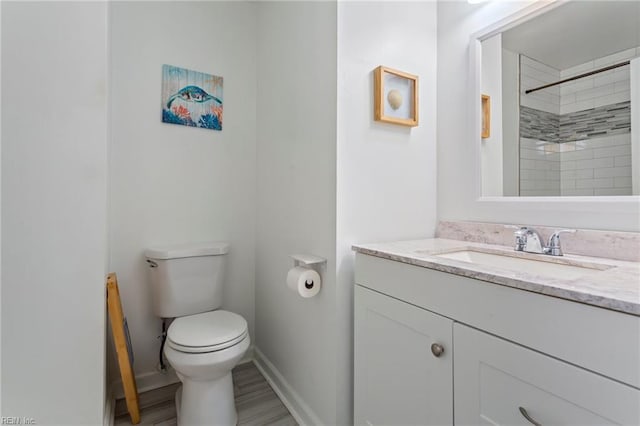 628 Briarwood Dr, Chesapeake, VA 23322 - full bathroom featuring toilet, vanity, baseboards, tiled shower, and wood finished floors