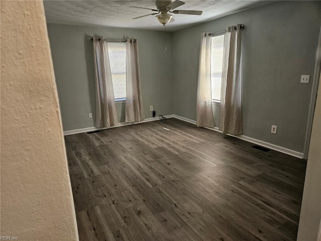 107 Cherry Acres Dr, Hampton, VA 23669 - spare room with healthy amount of natural light, ceiling fan, dark wood-type flooring, baseboards, and a textured ceiling