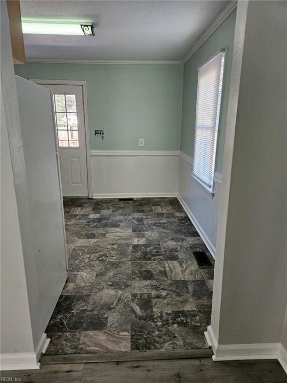 107 Cherry Acres Dr, Hampton, VA 23669 - unfurnished room with crown molding, plenty of natural light, and a wainscoted wall