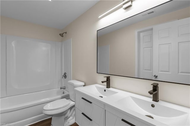 full bathroom featuring toilet, shower / washtub combination, and double vanity