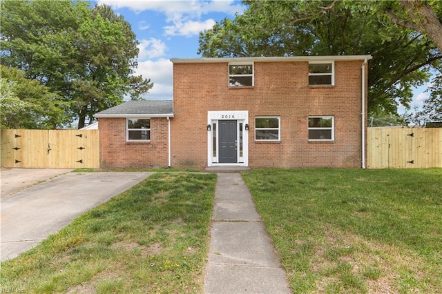 view of front of property featuring a gate and brick siding
