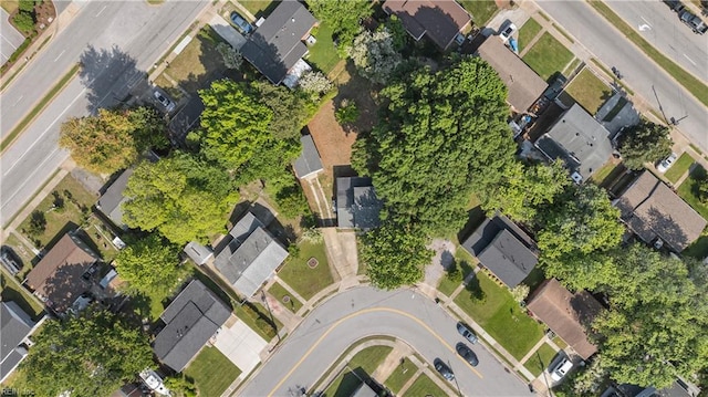 aerial view of property and surrounding area featuring nearby suburban area