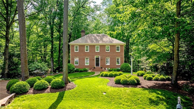 105 Sixpence Ct, Williamsburg, VA 23185 - colonial inspired home featuring a chimney and a front lawn