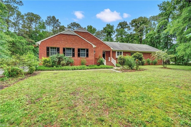 8 Pinckney Ln, Poquoson, VA 23662 - ranch-style house featuring a front yard and brick siding