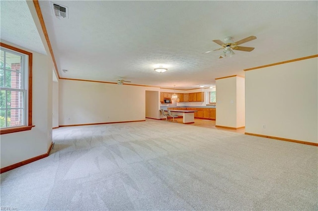 8 Pinckney Ln, Poquoson, VA 23662 - unfurnished living room featuring light carpet, plenty of natural light, crown molding, baseboards, and a textured ceiling