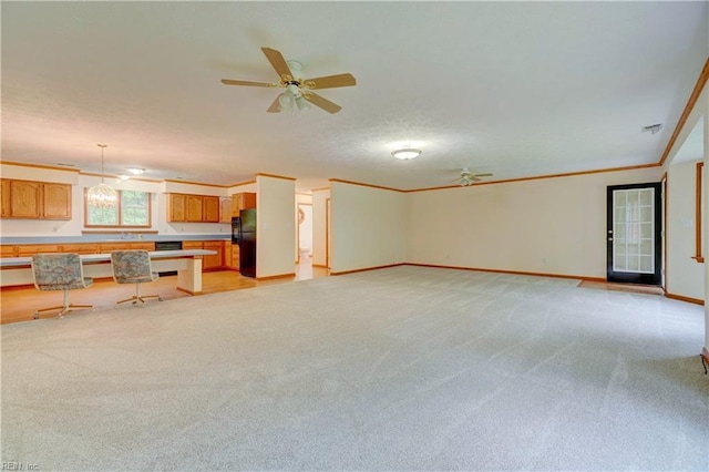8 Pinckney Ln, Poquoson, VA 23662 - unfurnished living room featuring light colored carpet, a ceiling fan, baseboards, crown molding, and a sink