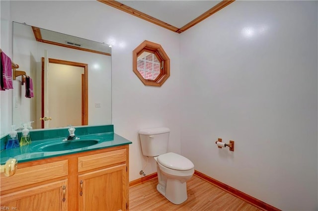 8 Pinckney Ln, Poquoson, VA 23662 - half bathroom featuring crown molding, toilet, wood finished floors, baseboards, and vanity