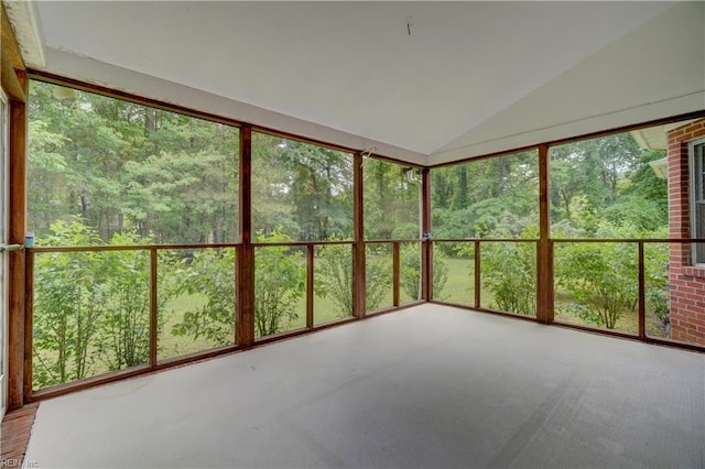 8 Pinckney Ln, Poquoson, VA 23662 - unfurnished sunroom featuring lofted ceiling, carpet, and a view of trees