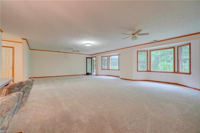 8 Pinckney Ln, Poquoson, VA 23662 - unfurnished living room featuring crown molding, baseboards, light carpet, ceiling fan, and a textured ceiling