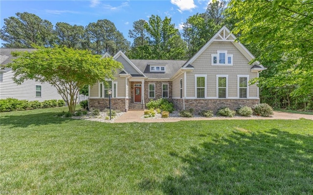 craftsman house with stone siding and a front lawn