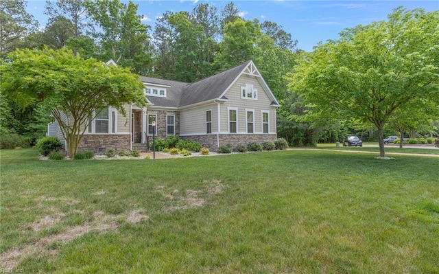 view of front of property with stone siding and a front yard