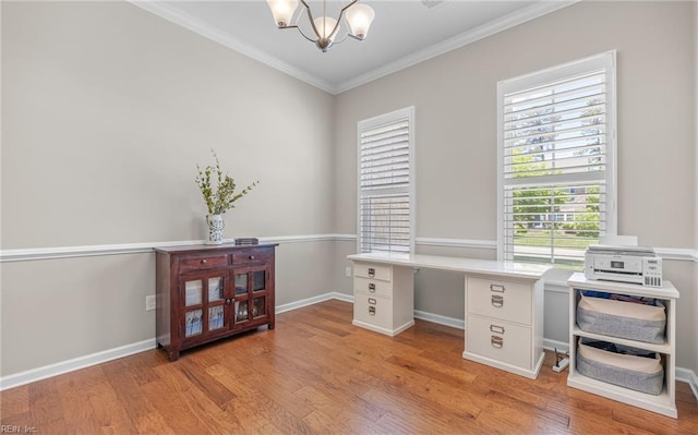 office featuring a chandelier, ornamental molding, light wood-style floors, and baseboards