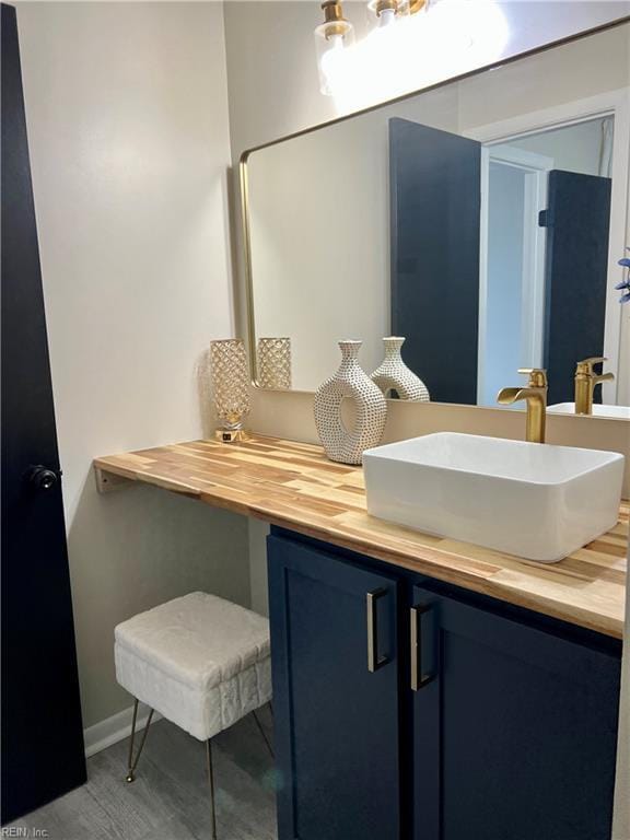 bathroom featuring vanity and baseboards