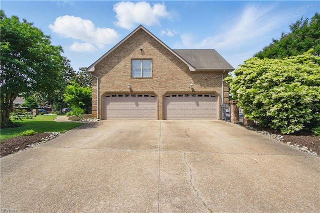200 Avonlea Dr, Chesapeake, VA 23322 - view of front of home featuring brick siding, concrete driveway, a garage, and a front lawn