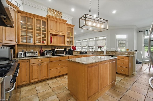 200 Avonlea Dr, Chesapeake, VA 23322 - kitchen featuring stainless steel appliances, crown molding, a peninsula, a kitchen island, and extractor fan