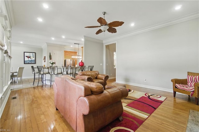 200 Avonlea Dr, Chesapeake, VA 23322 - living room with light wood finished floors, crown molding, ceiling fan, baseboards, and recessed lighting