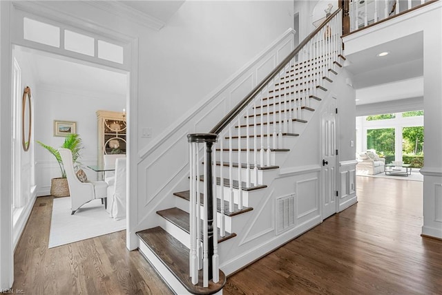 2900 Thomas Smith Ln, Williamsburg, VA 23185 - stairway featuring a decorative wall, wood finished floors, and crown molding