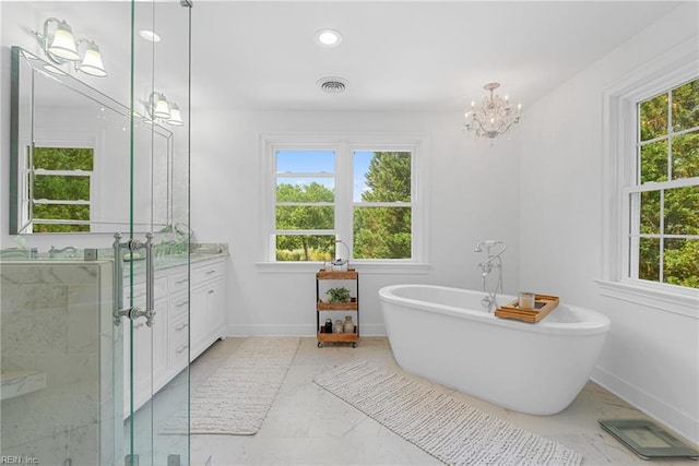 2900 Thomas Smith Ln, Williamsburg, VA 23185 - bathroom featuring vanity, a freestanding tub, a chandelier, marble finish flooring, and a shower stall