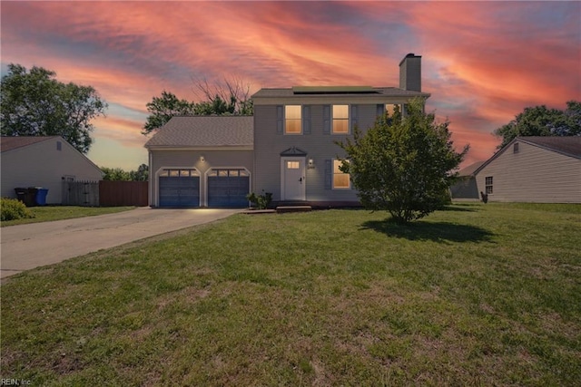 2809 Cedar Cove Ln, Chesapeake, VA 23323 - view of front of property with a chimney, an attached garage, driveway, and solar panels