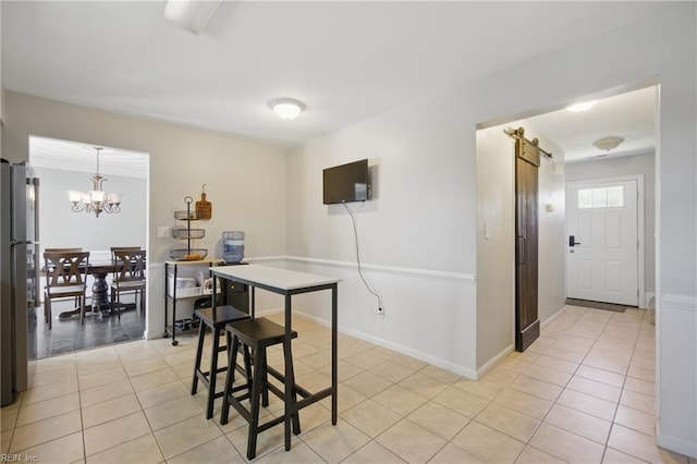 2809 Cedar Cove Ln, Chesapeake, VA 23323 - dining space with a chandelier, light tile patterned floors, and a barn door