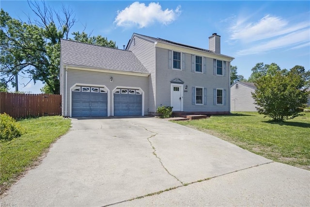 2809 Cedar Cove Ln, Chesapeake, VA 23323 - colonial house featuring a garage, a chimney, and driveway