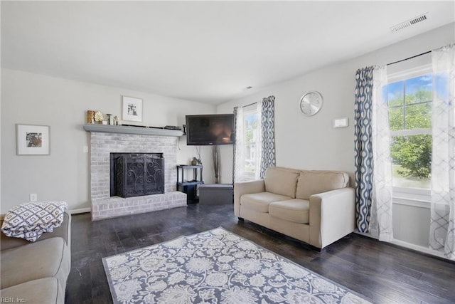 2809 Cedar Cove Ln, Chesapeake, VA 23323 - living area with healthy amount of natural light, wood finished floors, and a brick fireplace