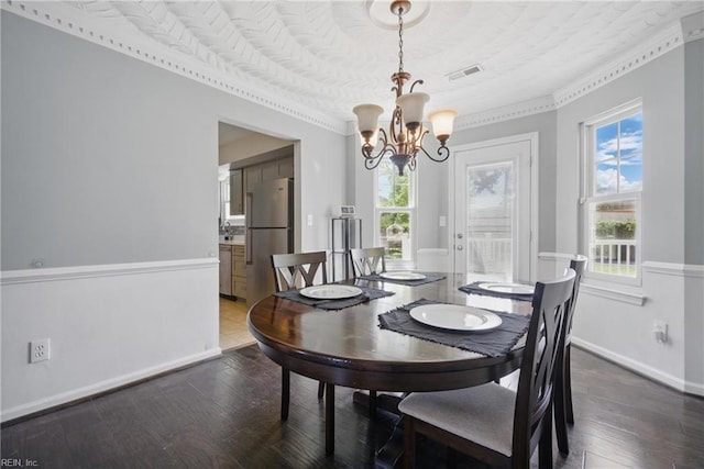 2809 Cedar Cove Ln, Chesapeake, VA 23323 - dining room featuring a chandelier, plenty of natural light, wood finished floors, and crown molding