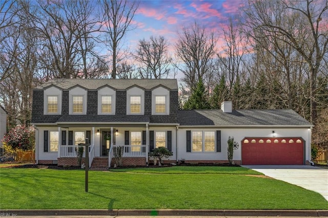 13 Hunt Wood Dr, Poquoson, VA 23662 - view of front of property featuring an attached garage, covered porch, concrete driveway, a yard, and a chimney
