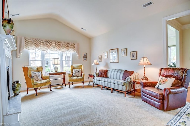 carpeted living area with healthy amount of natural light, vaulted ceiling, and a fireplace
