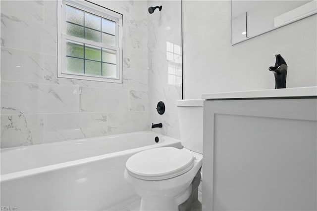 bathroom with toilet, vanity, and shower / tub combination