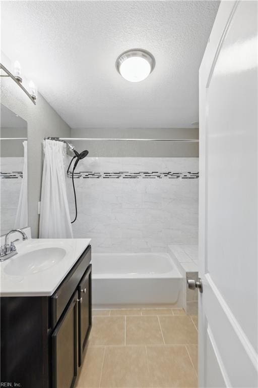 1117 Perry St, Chesapeake, VA 23324 - bathroom featuring tile patterned flooring, vanity, shower / bath combo with shower curtain, and a textured ceiling