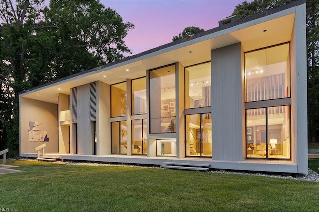 1336 Moyer Rd, Newport News, VA 23606 - back of house at dusk featuring a lawn