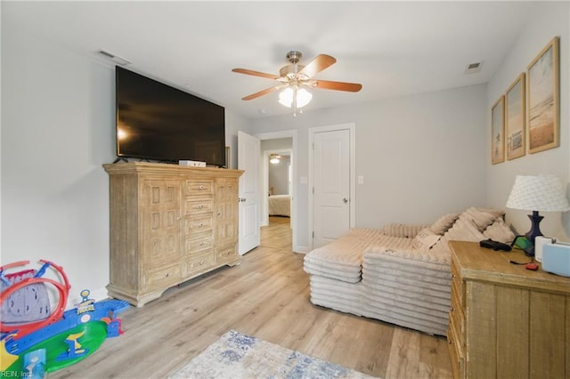 bedroom featuring light wood-type flooring and a ceiling fan