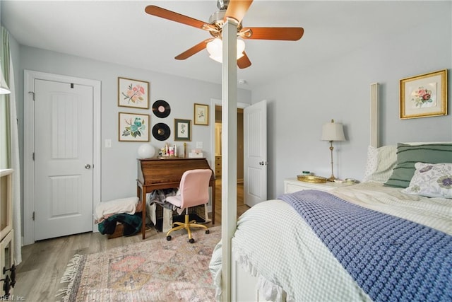 bedroom with wood finished floors and ceiling fan