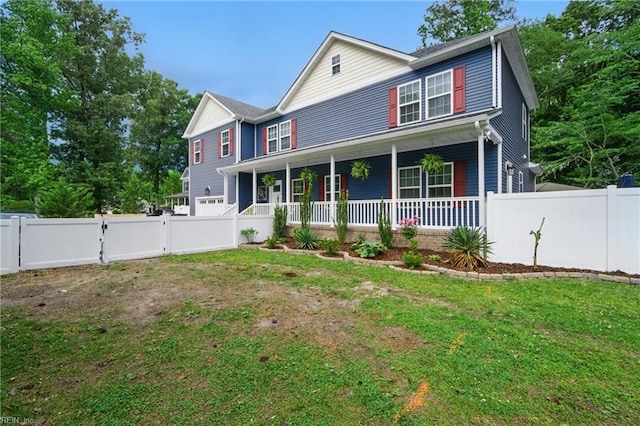 view of front of home featuring covered porch and a gate