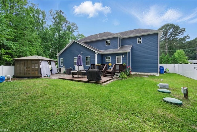 back of property featuring a deck