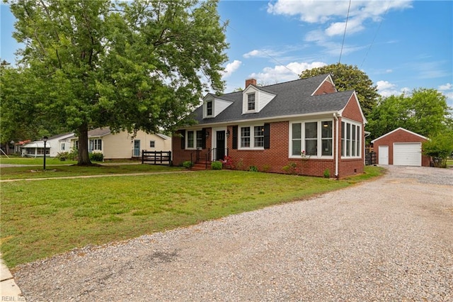 cape cod-style house with brick siding, an outbuilding, driveway, a garage, and a chimney