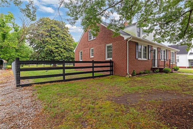 view of home's exterior featuring brick siding