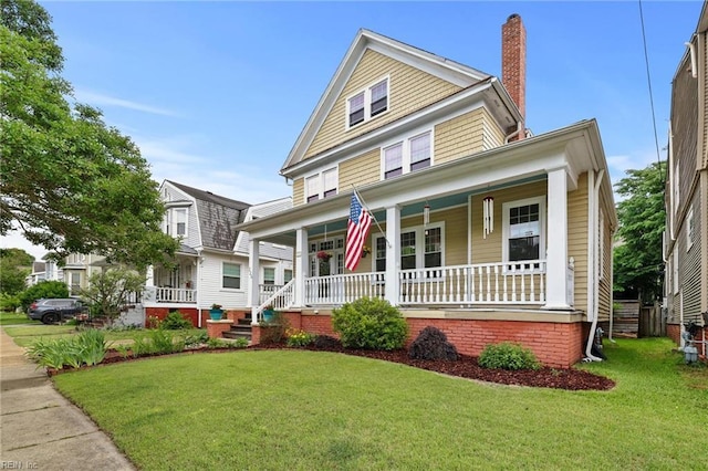 226 Lucile Ave, Norfolk, VA 23504 - traditional style home featuring covered porch, a chimney, and a front yard