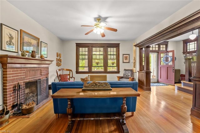 226 Lucile Ave, Norfolk, VA 23504 - living area with radiator heating unit, ceiling fan, wood finished floors, and a fireplace