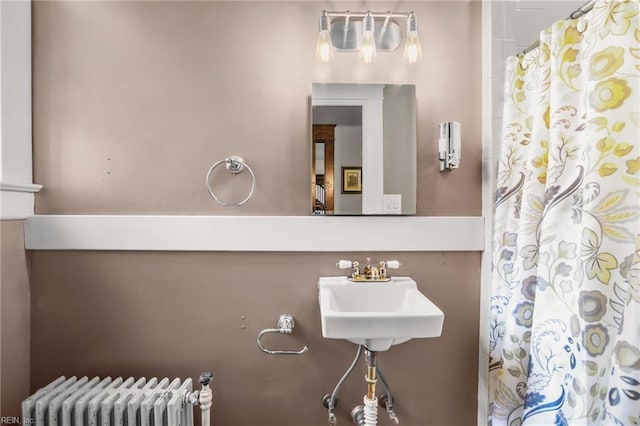 226 Lucile Ave, Norfolk, VA 23504 - full bathroom with radiator heating unit, curtained shower, and a sink