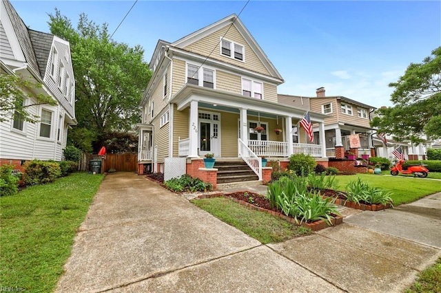 226 Lucile Ave, Norfolk, VA 23504 - traditional style home featuring covered porch, a front lawn, and concrete driveway