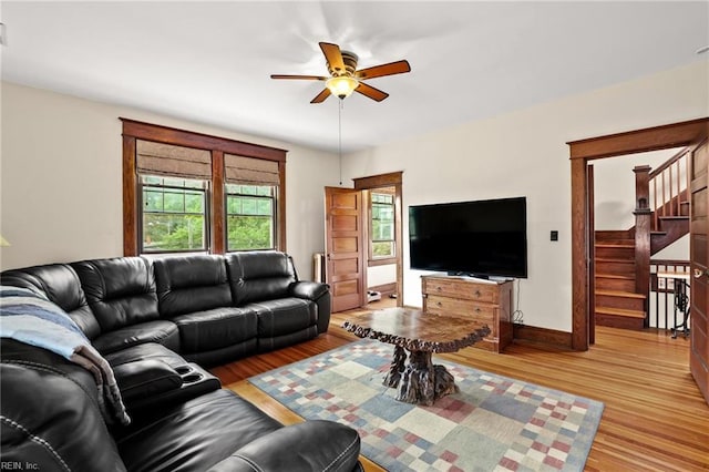226 Lucile Ave, Norfolk, VA 23504 - living room featuring ceiling fan, stairs, light wood finished floors, baseboards, and radiator heating unit