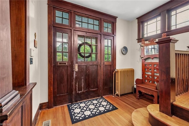226 Lucile Ave, Norfolk, VA 23504 - entrance foyer with radiator and light wood-style flooring