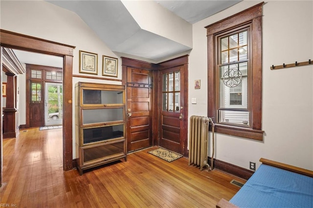226 Lucile Ave, Norfolk, VA 23504 - entrance foyer featuring radiator, hardwood / wood-style floors, baseboards, and vaulted ceiling